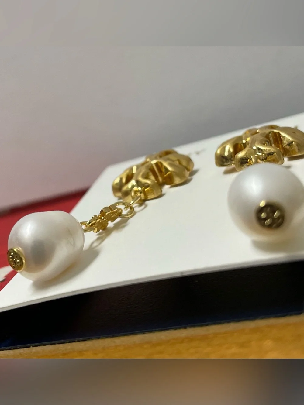 Brand new pearl-drop earrings by Tory Burch.